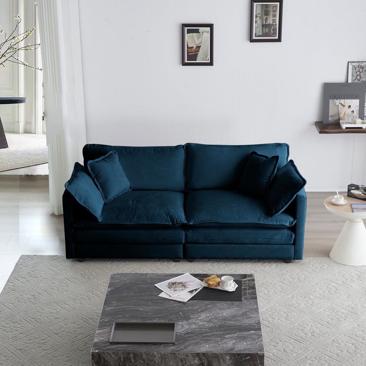 Deep teal velvet sofa with plush cushions and modern design