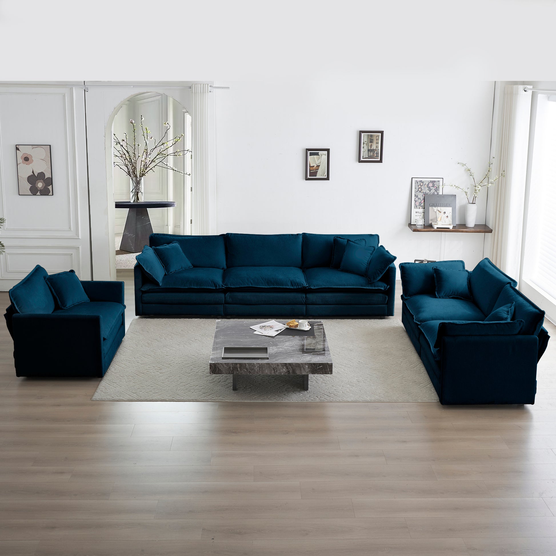 Plush teal velvet sectional sofa with accent pillows ideal for modern living rooms