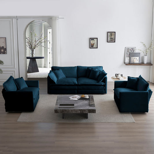 Deep teal velvet sofa with plush cushions in a modern living room setting