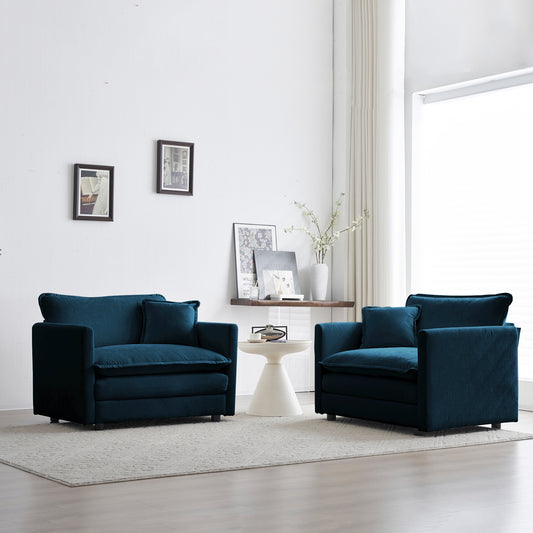 Deep teal velvet armchair with plush cushions perfect for a cozy living room setup