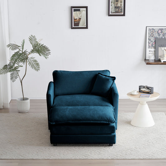 Teal velvet armchair with matching ottoman and throw pillow on a light rug
