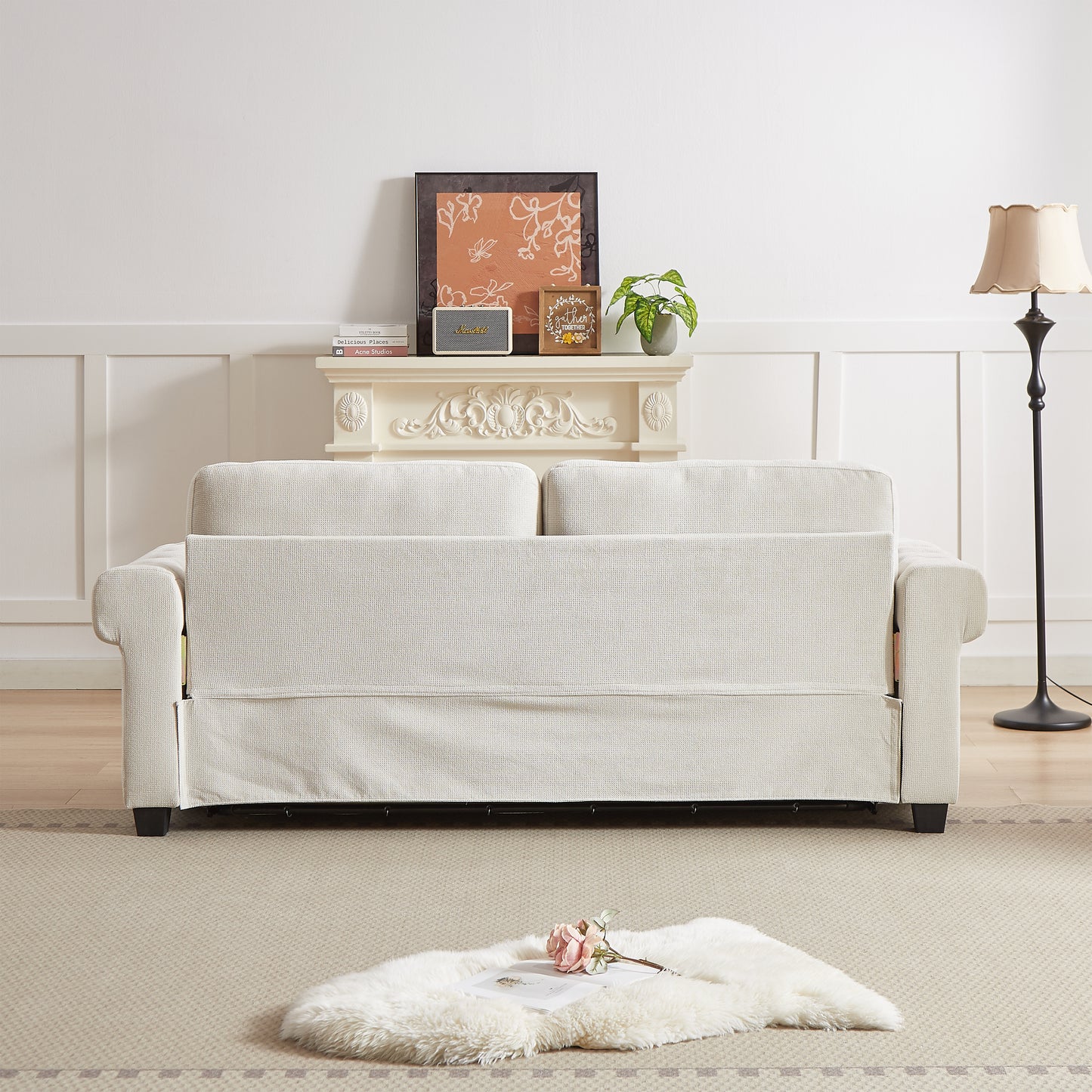 Neutral beige linen upholstered sofa with decorative throw pillows for a cozy living room setting