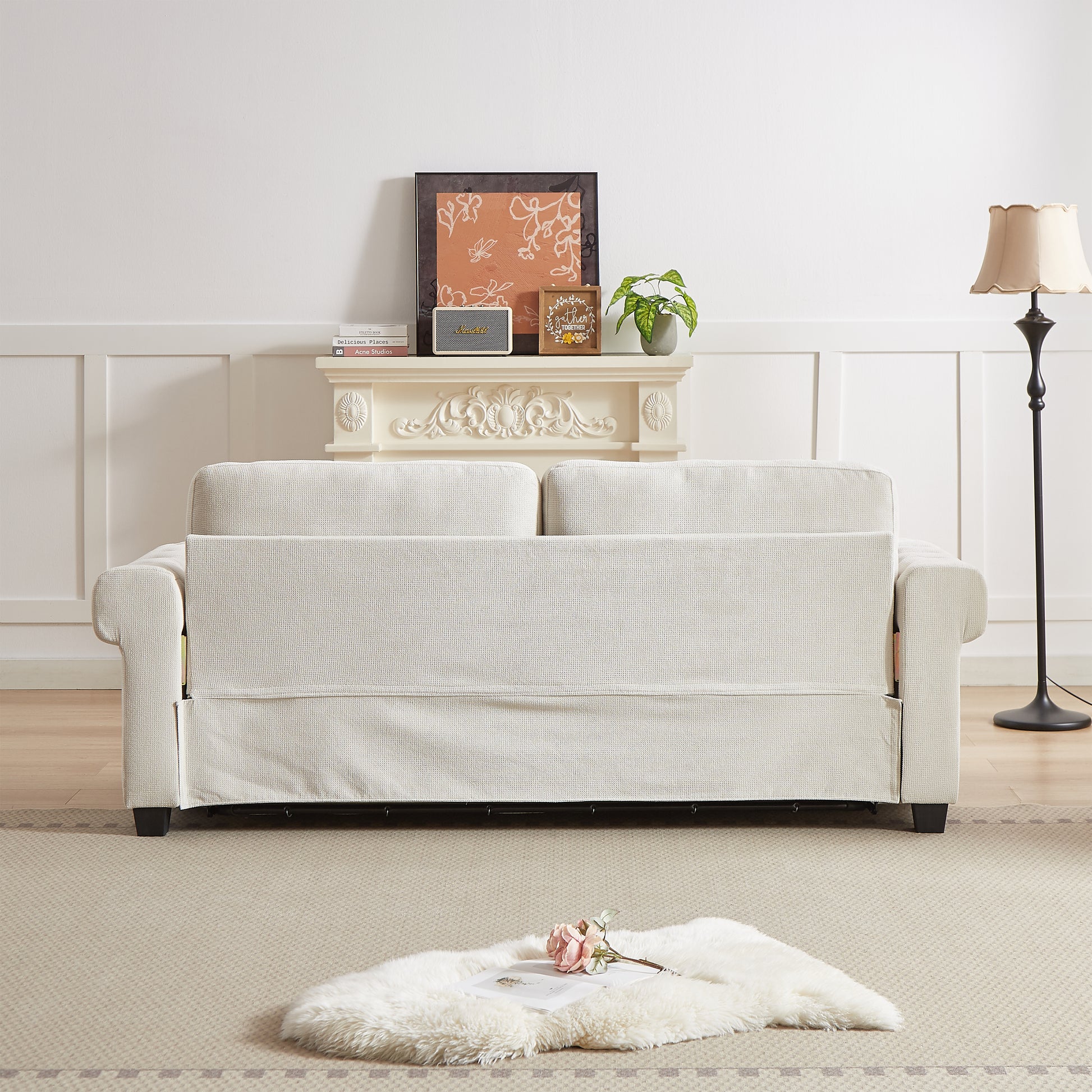 Neutral beige linen upholstered sofa with decorative throw pillows for a cozy living room setting