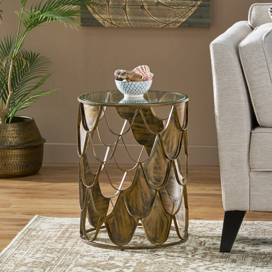 Round glass top side table with ornate gold metal base perfect for living rooms