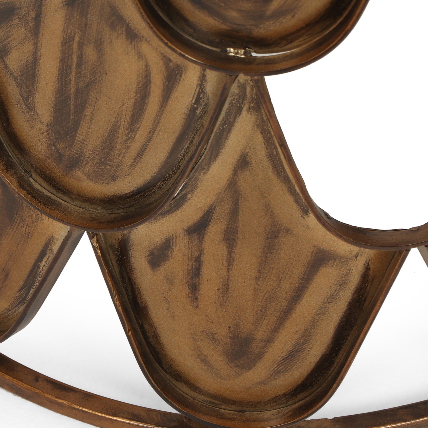 A vintage metal wine rack in antique bronze with a rustic brushed finish