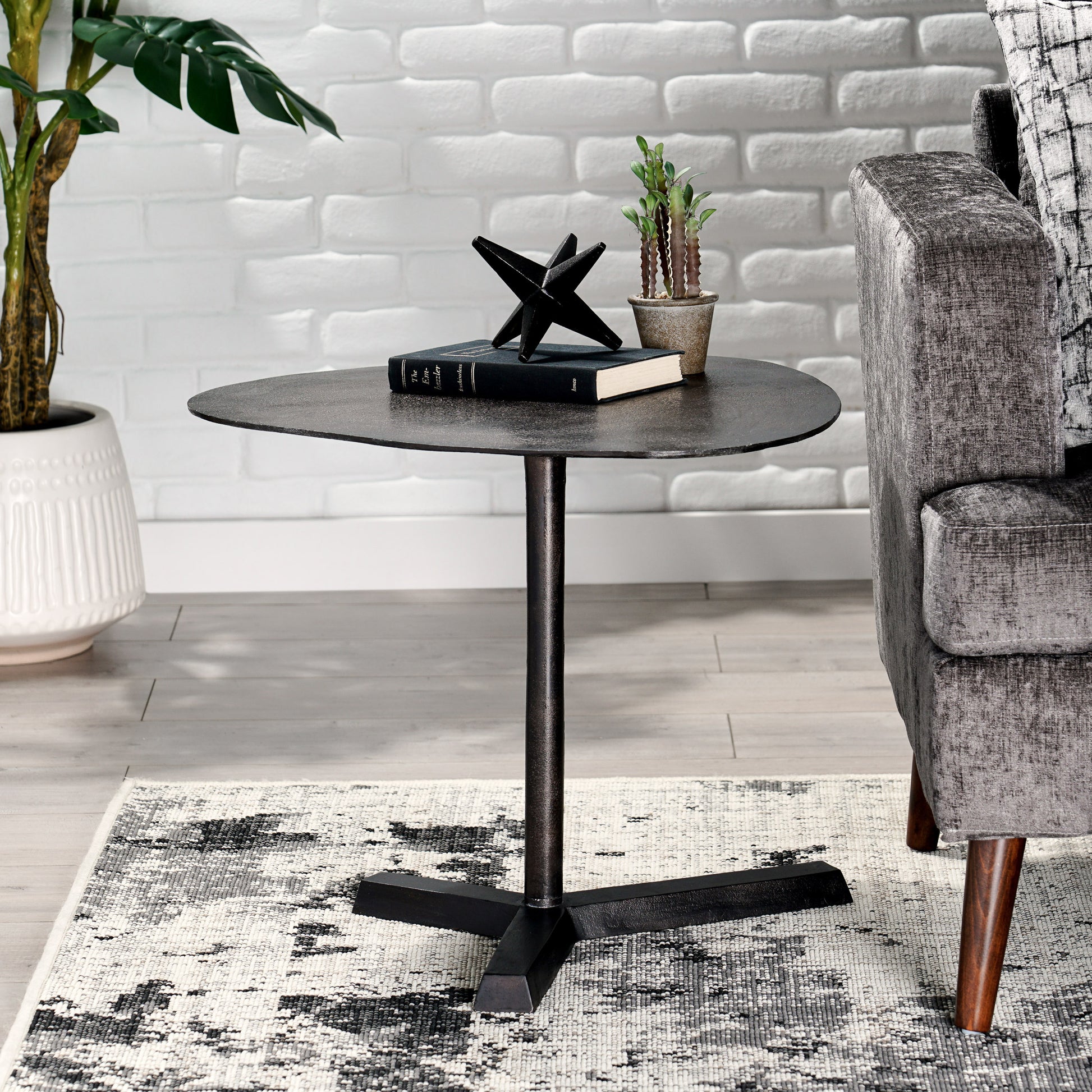 Dark metal accent side table with a unique organic shape perfect for living rooms