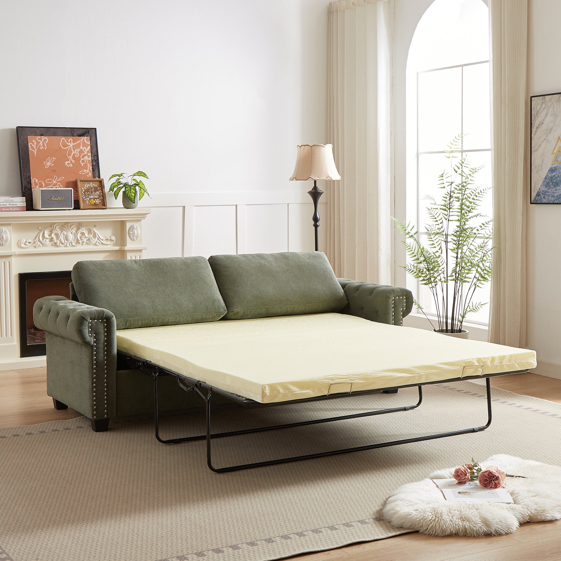 Green tufted sleeper sofa with cream mattress unfolded perfect for guest rooms