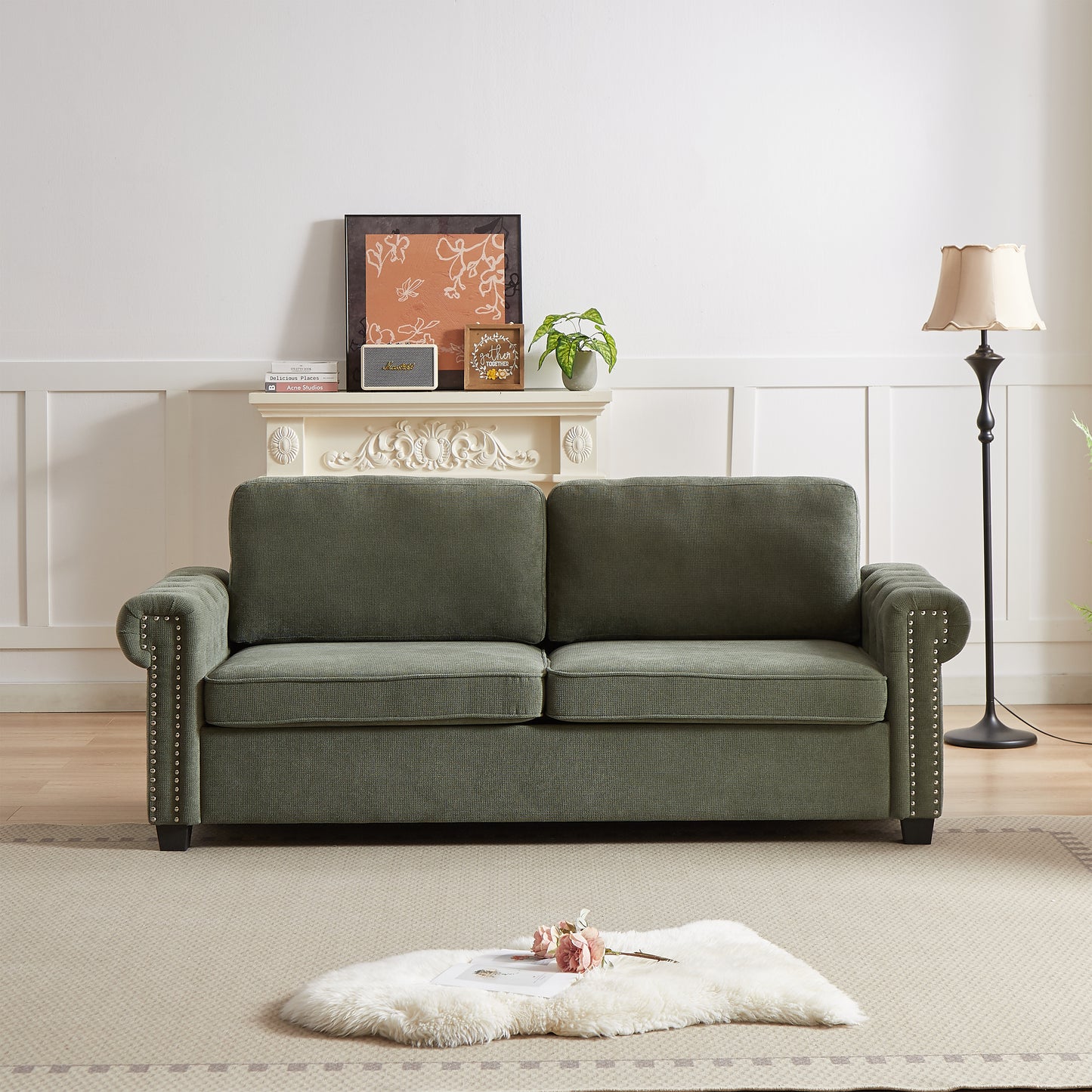 Green fabric chesterfield sofa with silver nailhead trim for living room comfort