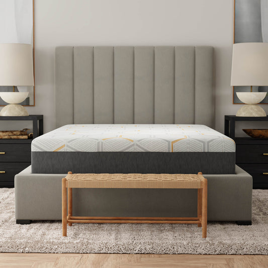 Queen size mattress with geometric grey and gold pattern on white on bed