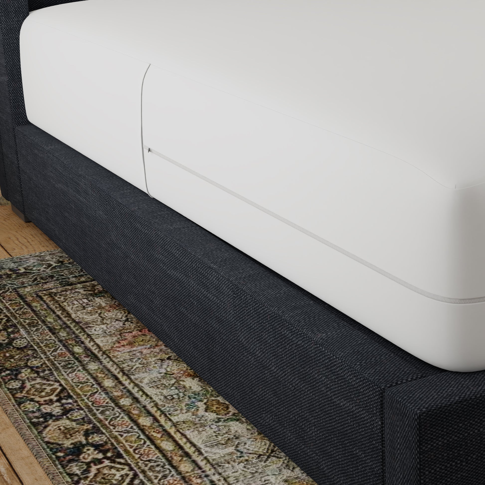 Dark grey upholstered bed frame with a crisp white mattress modern design