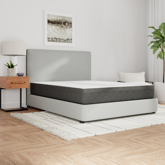 Gray and white hybrid mattress on a modern platform bed frame queen size