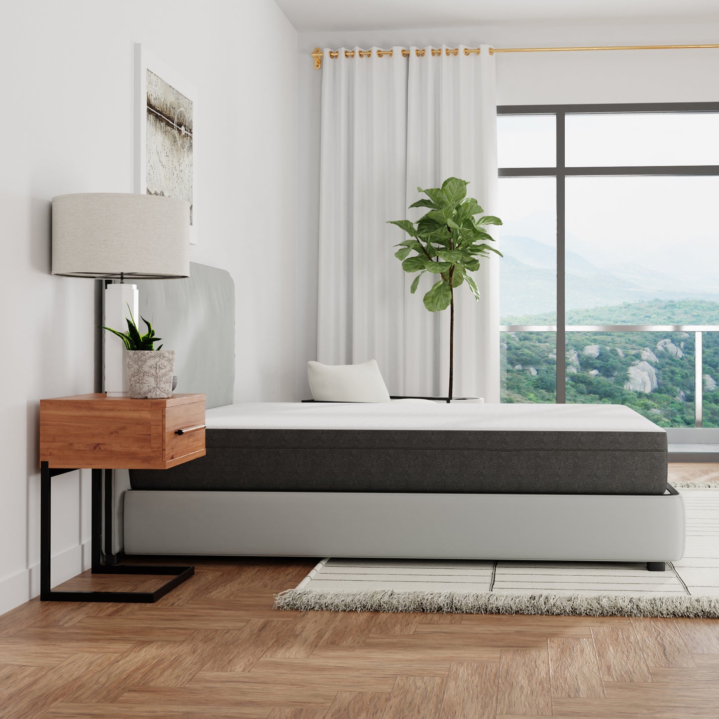 Charcoal gray and white memory foam mattress with a plush pillow on a light gray bed frame