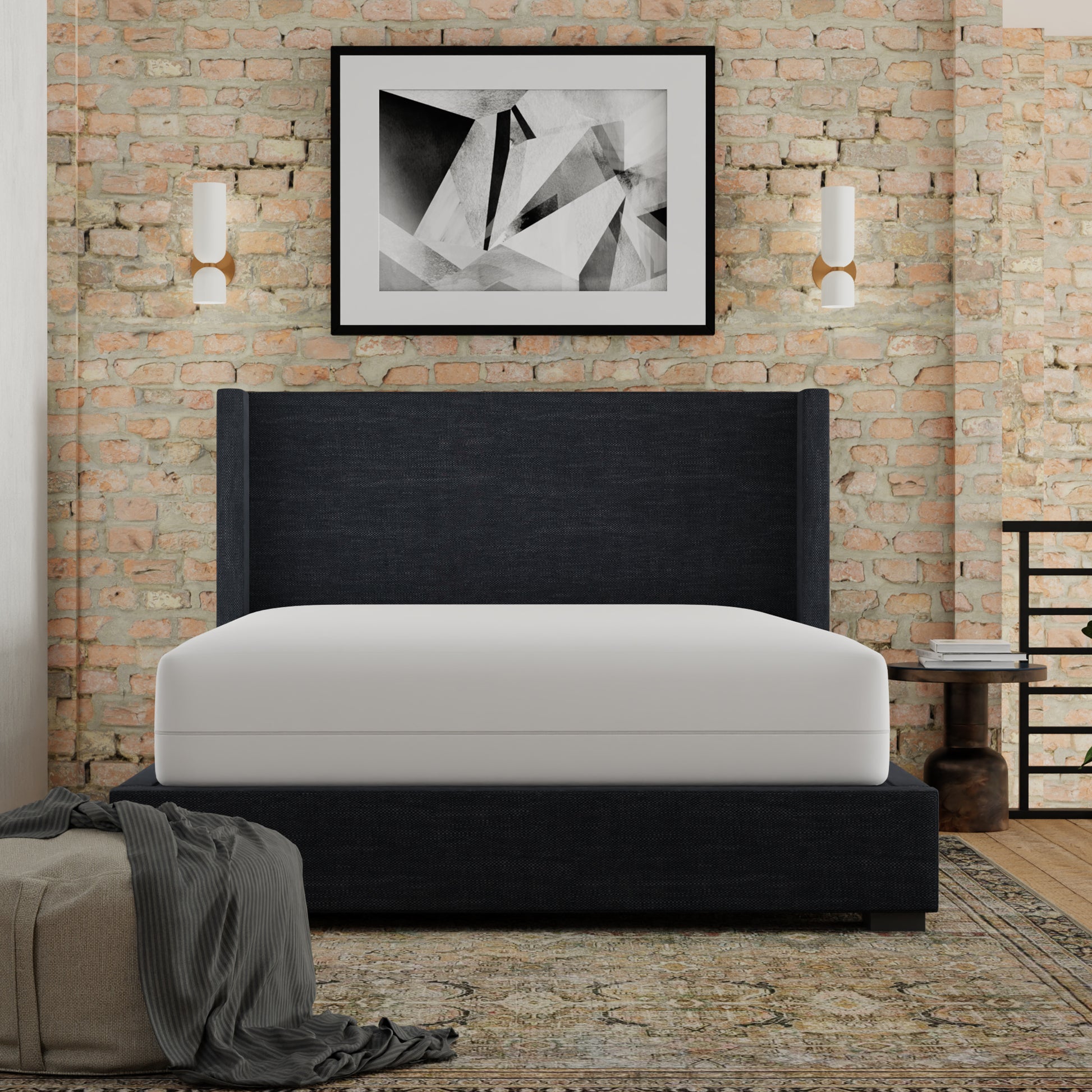 Dark grey upholstered bed frame with tall headboard and white mattress