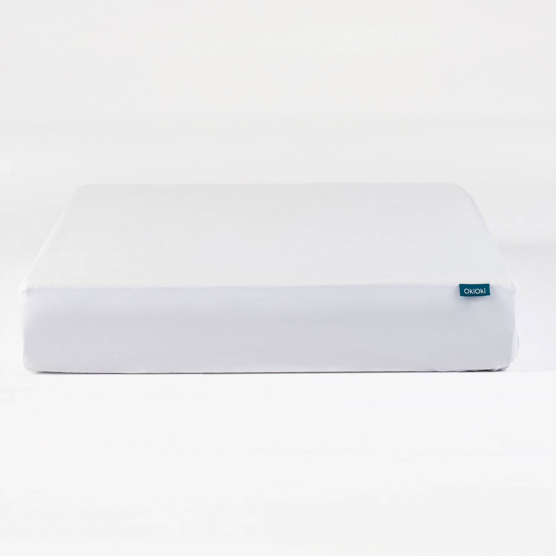 White OkiOki fitted mattress protector with elastic corners for secure fit
