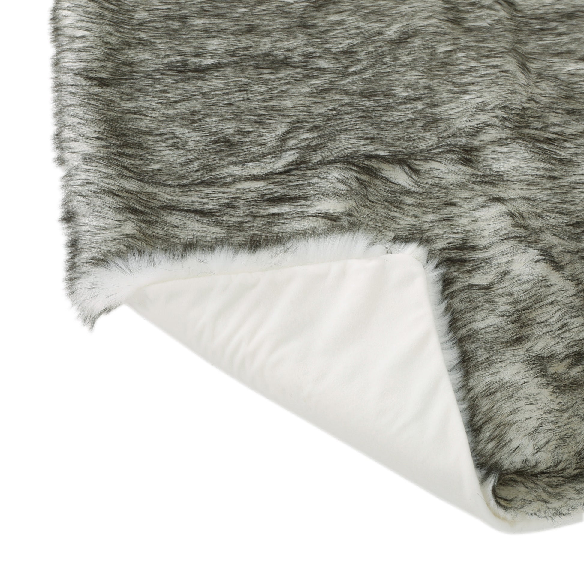 Closeup of a luxurious faux fur throw with grey and white strands on white backing