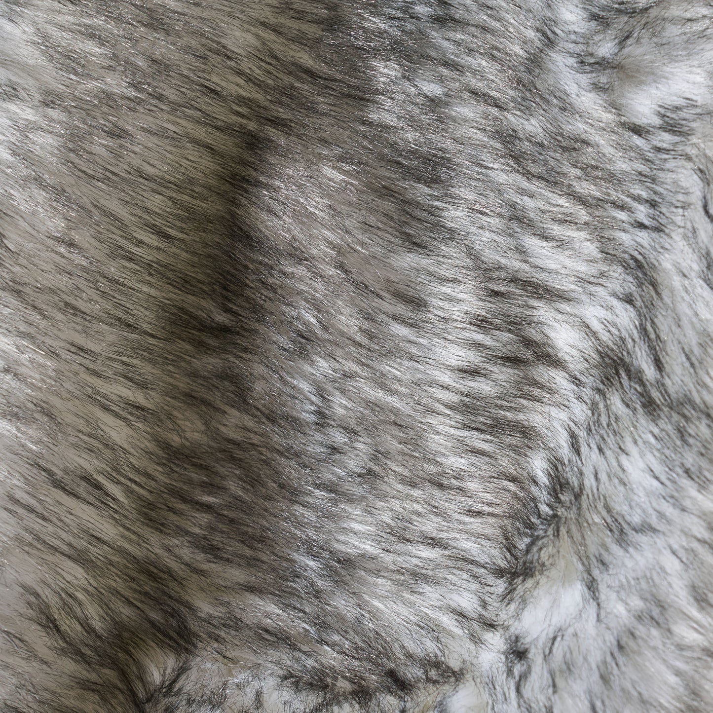 Closeup of grey and white faux fur texture soft and luxurious feel