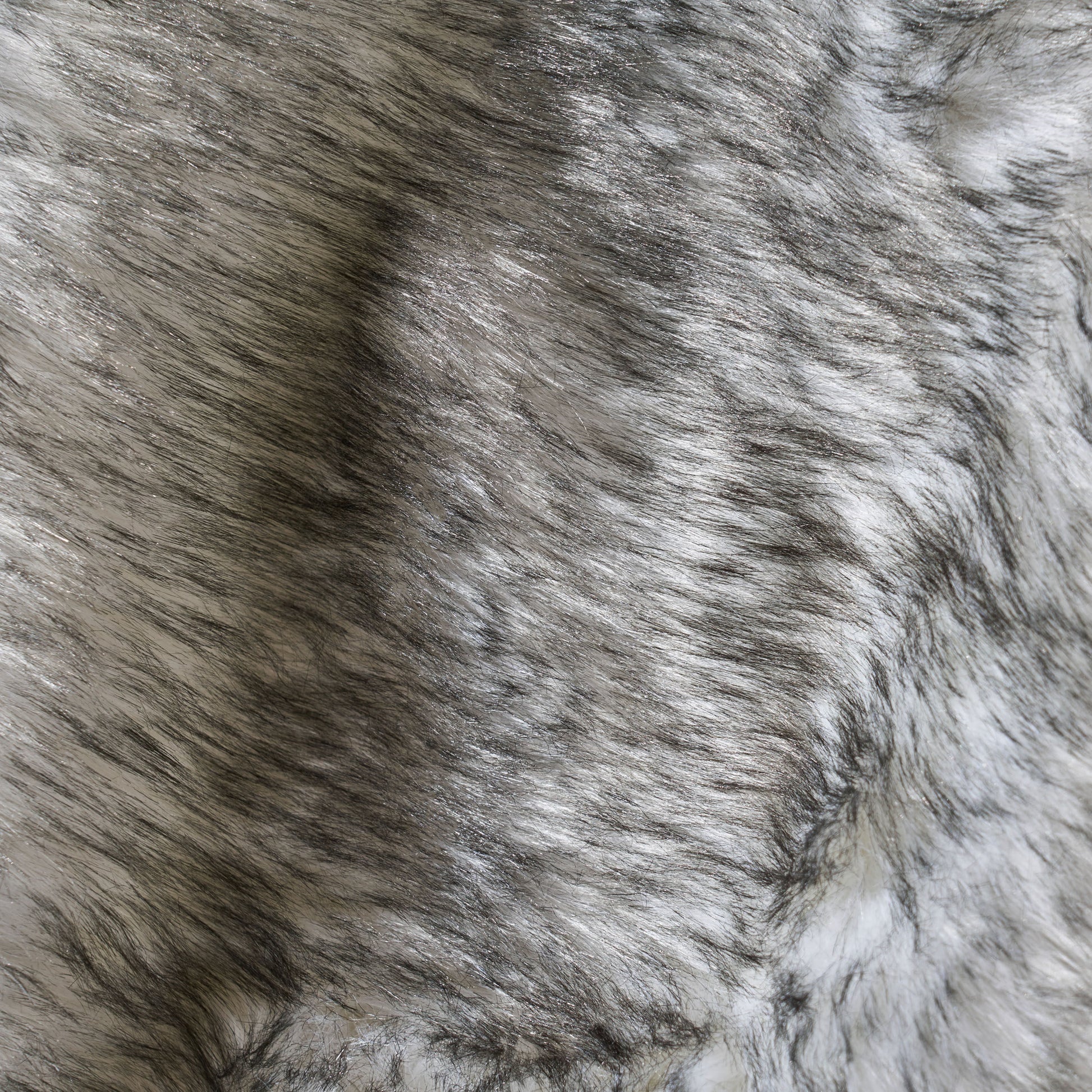 Closeup of grey and white faux fur texture soft and luxurious feel
