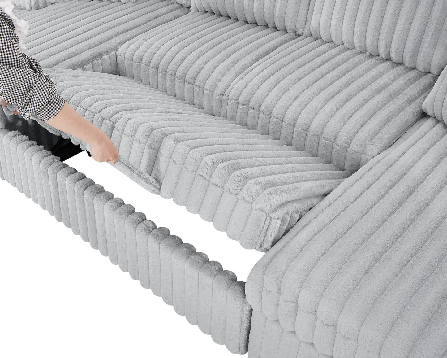 Hand pulling open a storage compartment on a plush grey sectional sofa