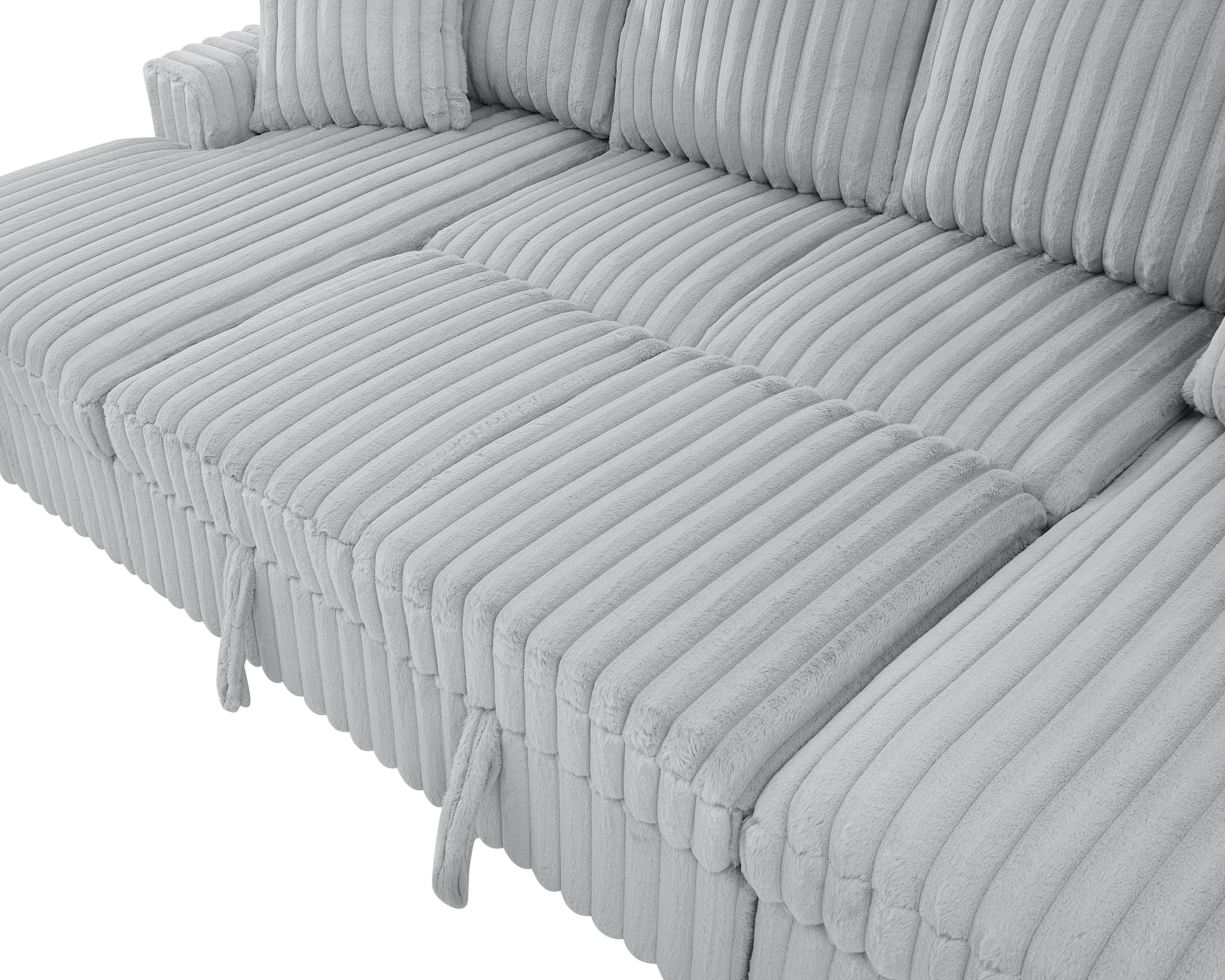 Light grey corduroy sectional sofa with plush textured cushions and removable pull tabs