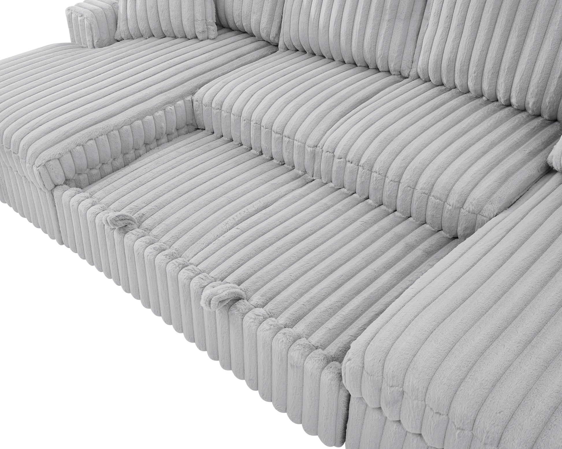 Closeup of a plush gray corduroy sectional sofa offering comfort and style for any living room