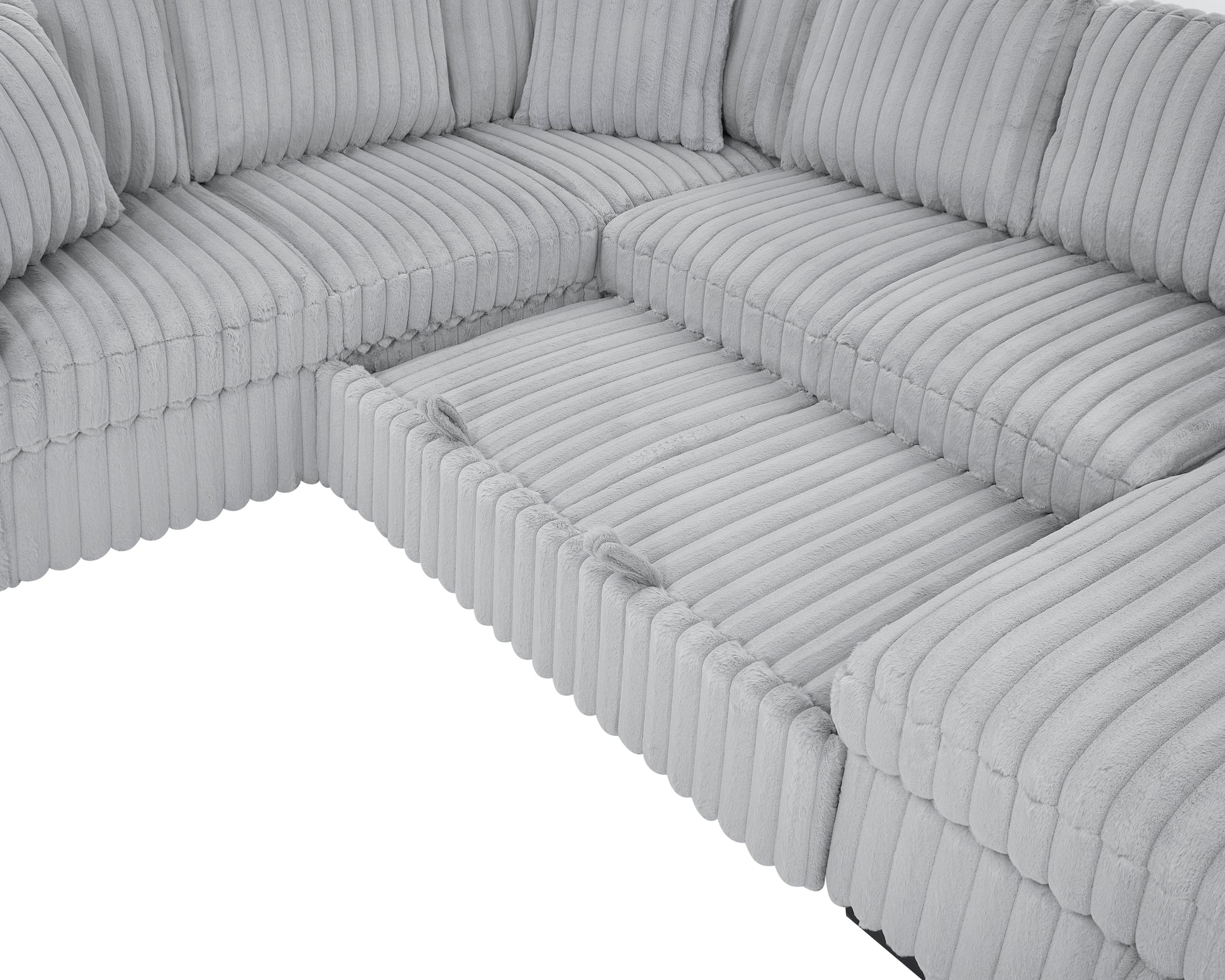 Plush light grey corduroy sectional sofa with plush pillows and ample seating space