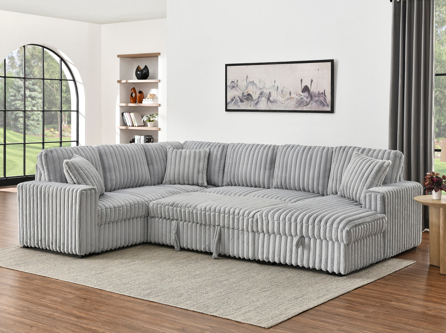 Plush grey corduroy sectional sofa with multiple accent pillows perfect for living room comfort