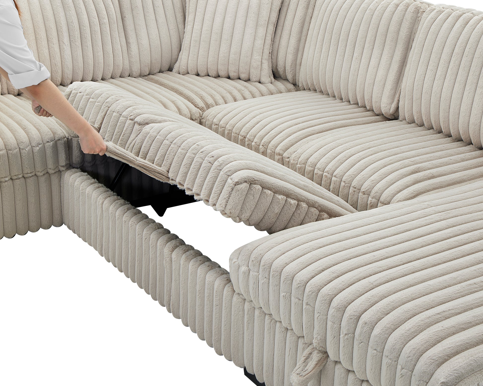 Closeup of a beige corduroy sectional sofa with a hand lifting a hidden storage compartment lid