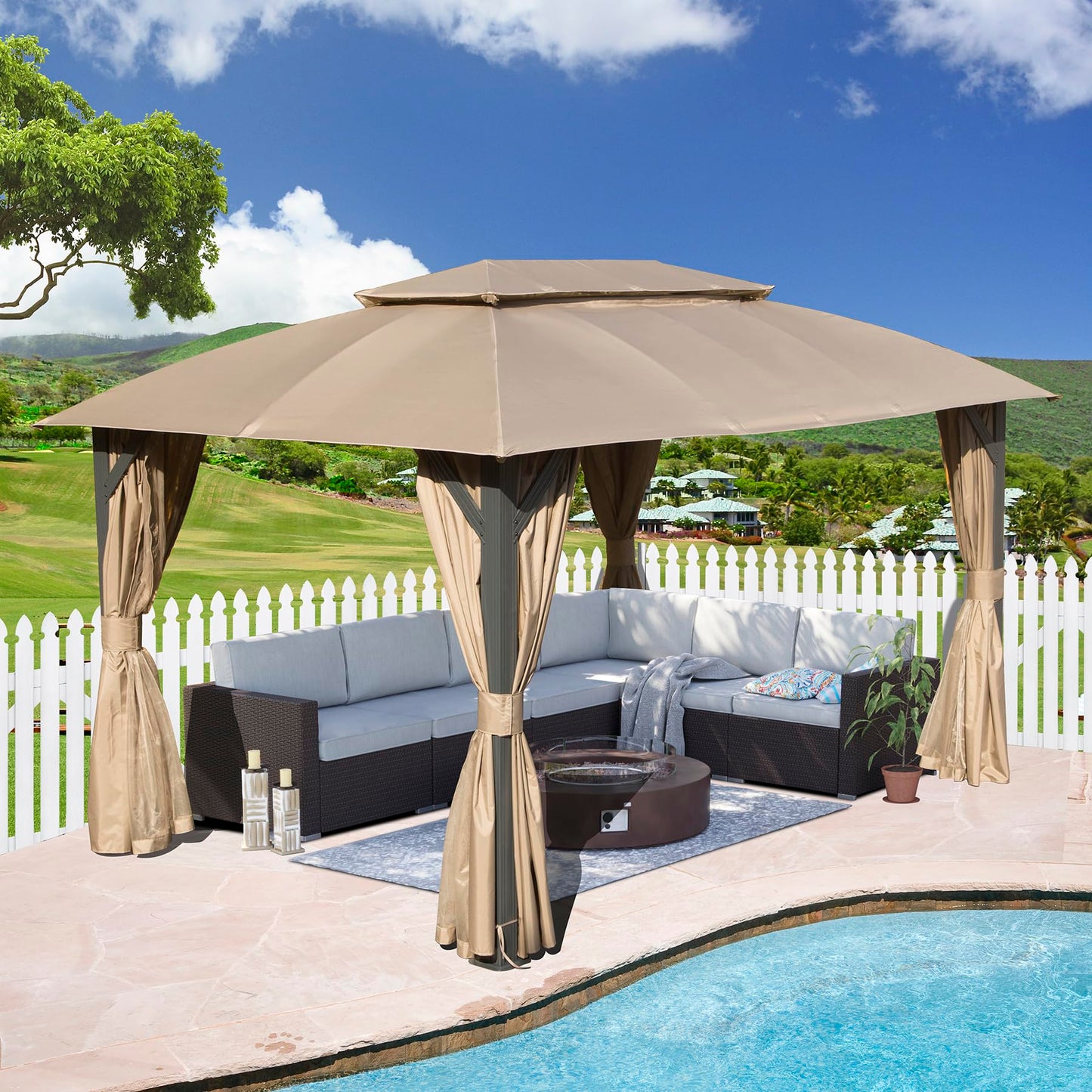 Large beige outdoor gazebo with taupe curtains housing a dark wicker sectional sofa and fire pit