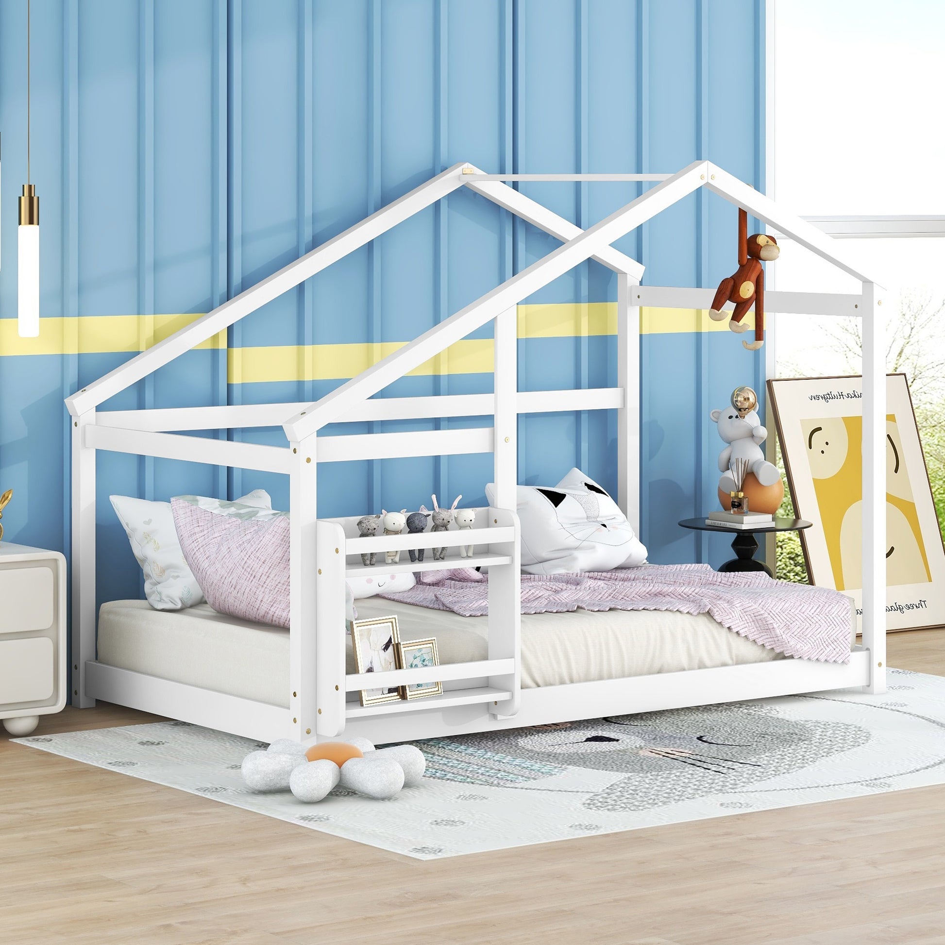 White wooden house bed frame with playful monkey hanging