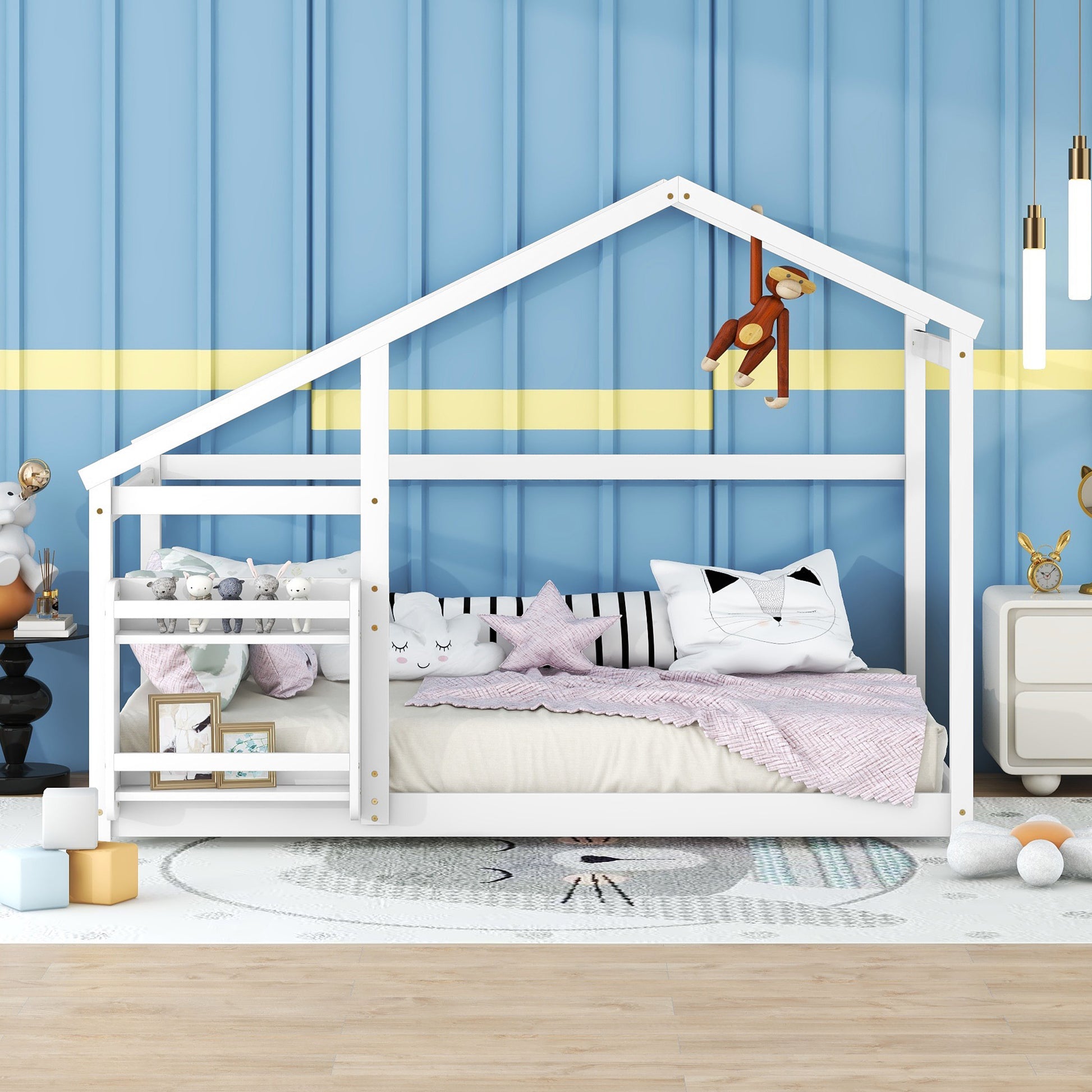 White wooden house bed frame with playful stuffed animals and star pillow
