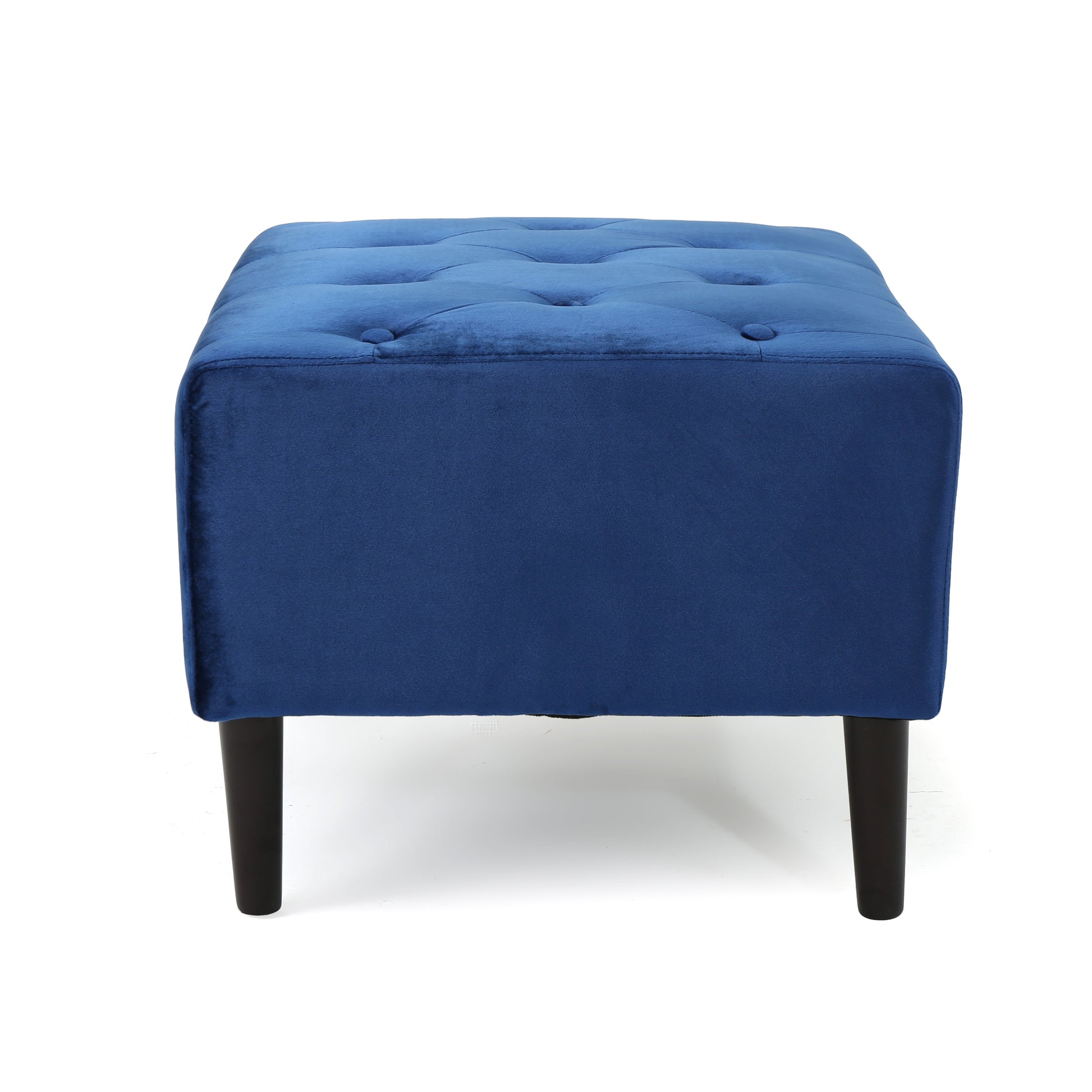 Tufted navy velvet ottoman with dark tapered legs perfect for footrest or extra seating