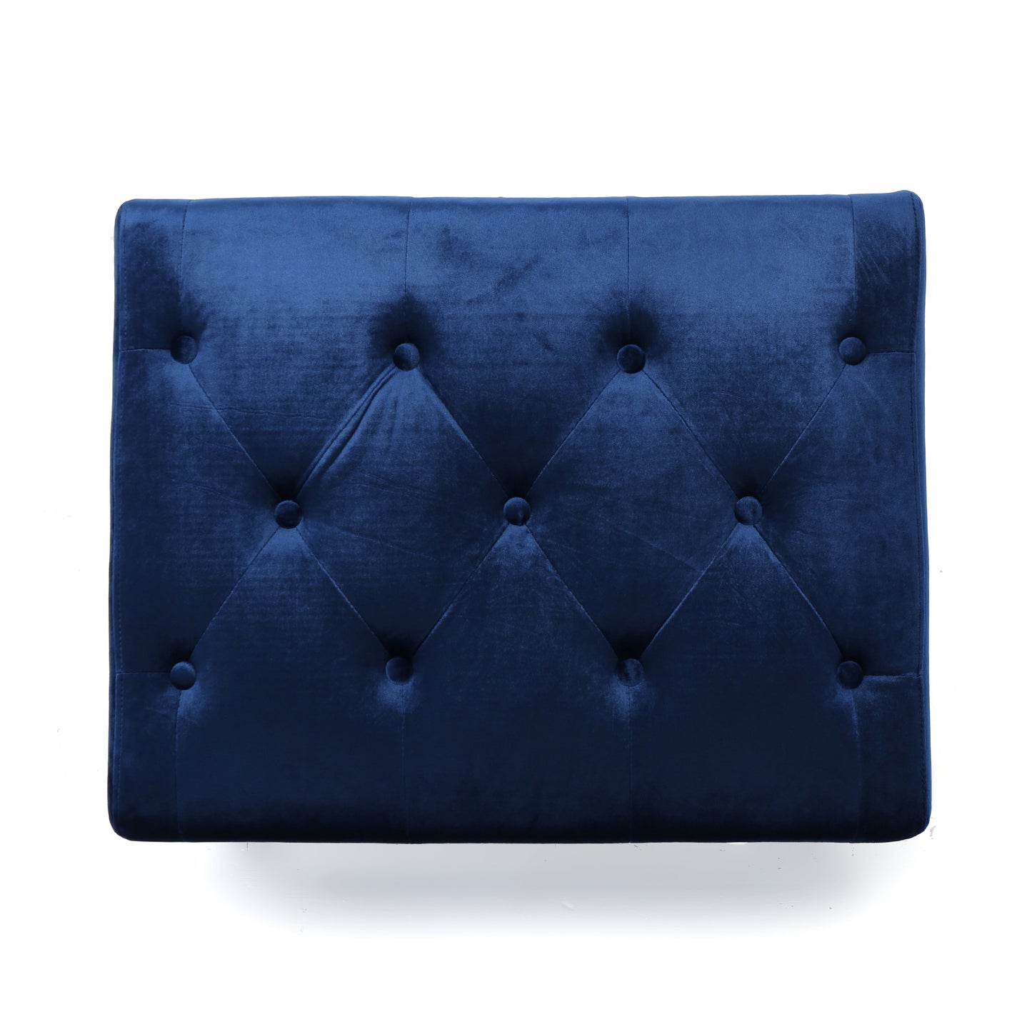 Deep navy blue velvet headboard with diamond tufting detail