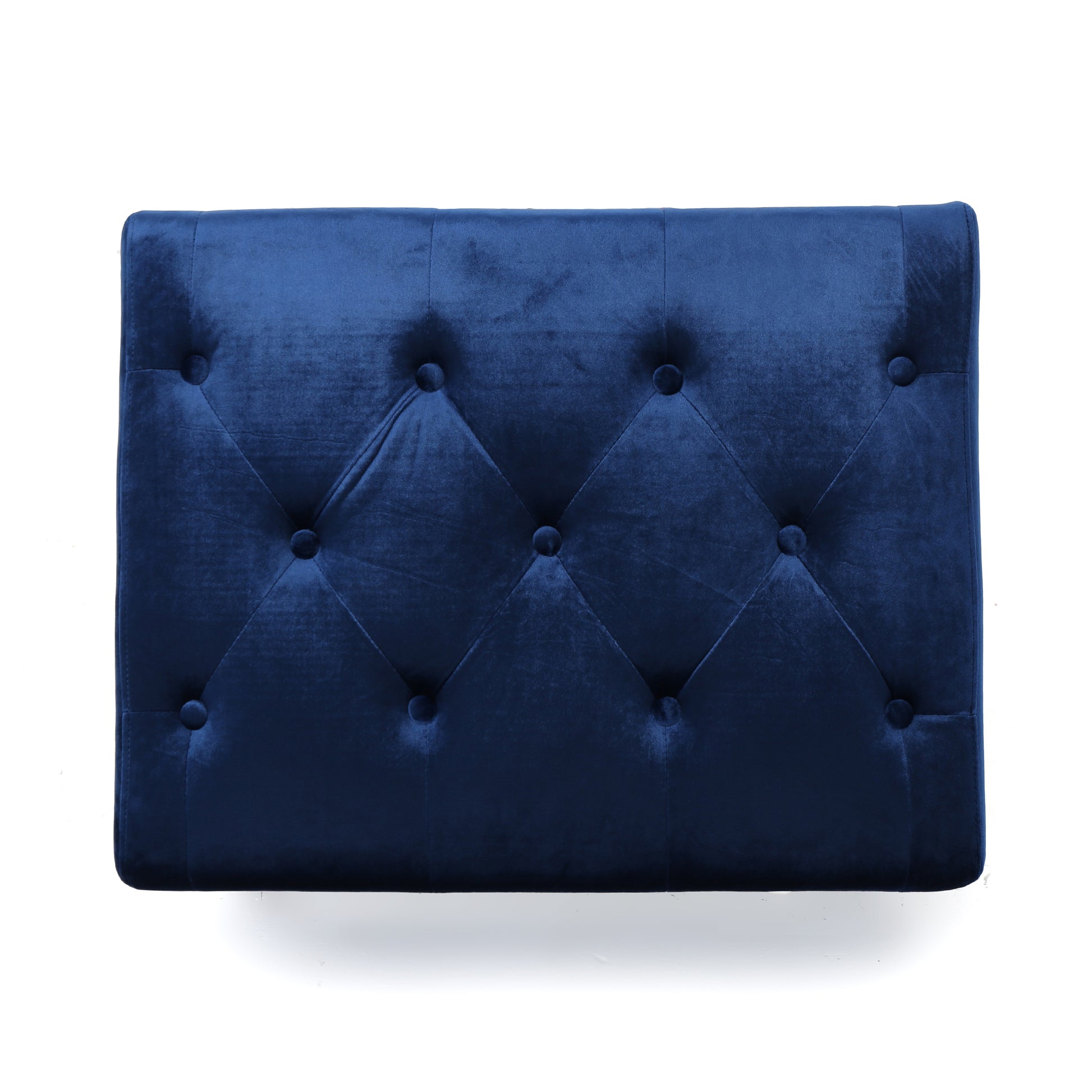 Deep navy blue velvet headboard with diamond tufting detail