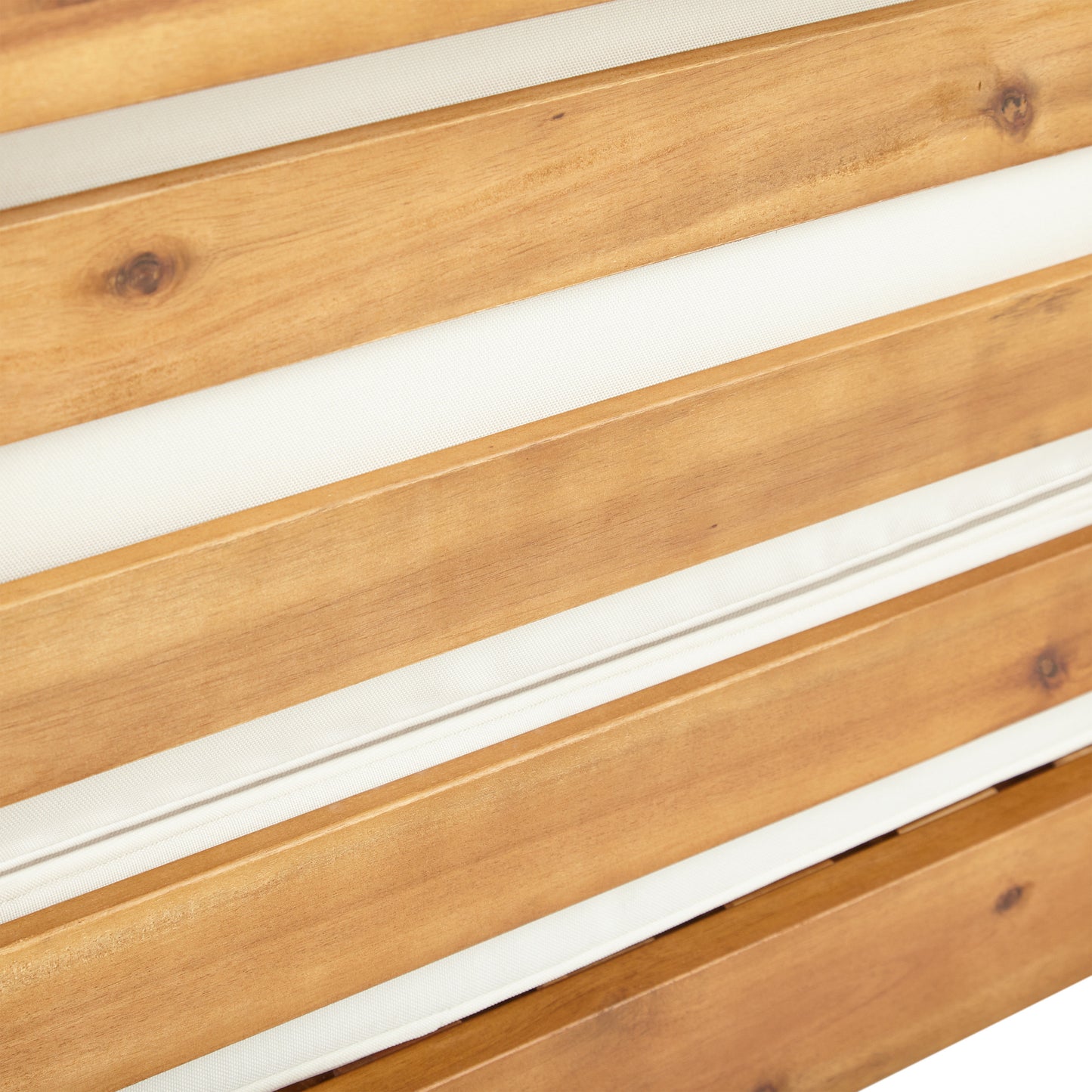 Closeup of natural acacia wood slats with white cushion detail ideal for outdoor furniture