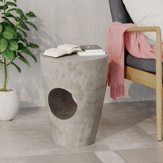Round gray concrete side table with cutout perfect accent for modern living rooms