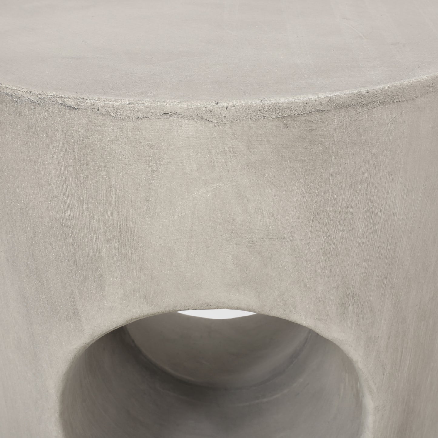 Textured grey concrete cylinder stool with open center