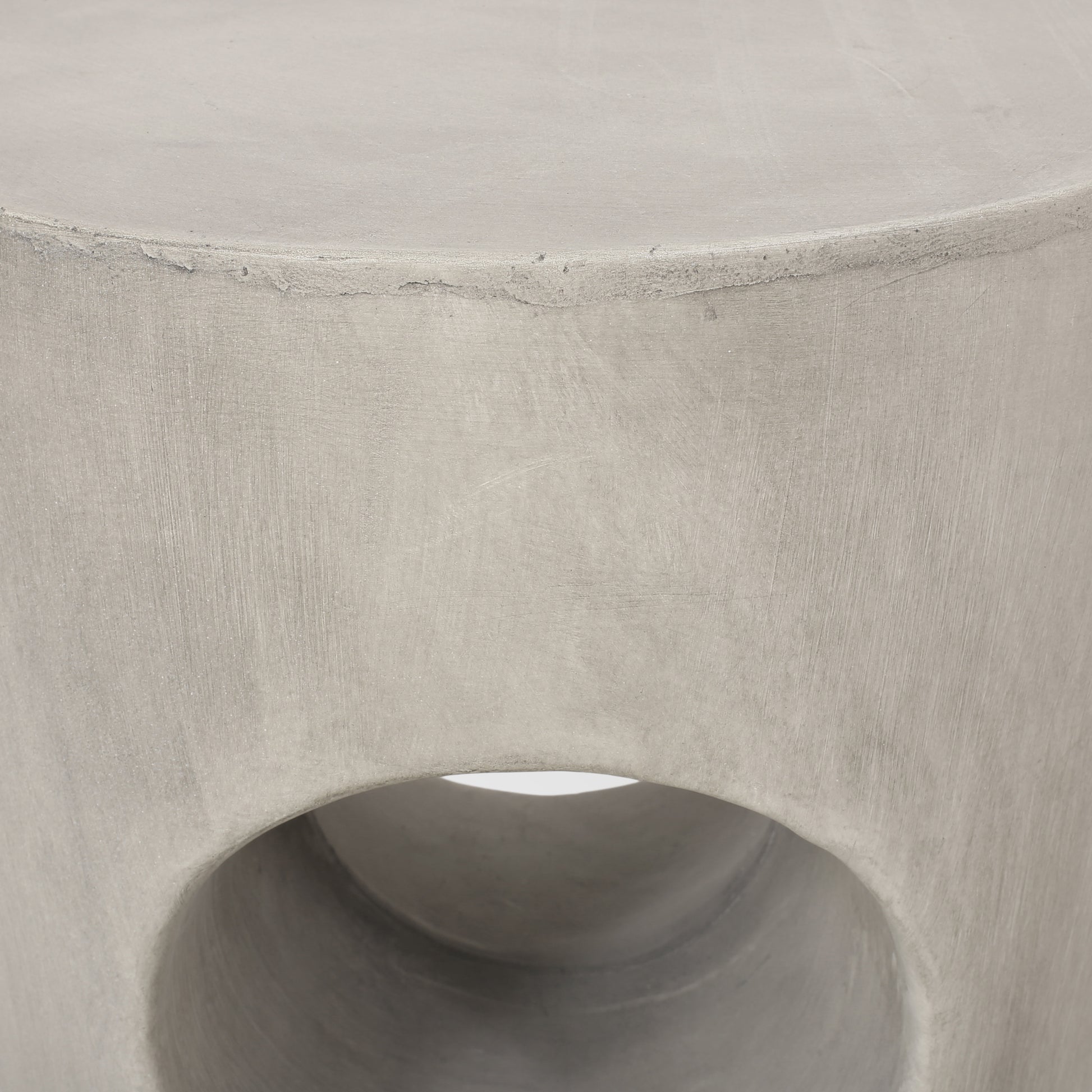 Textured grey concrete cylinder stool with open center