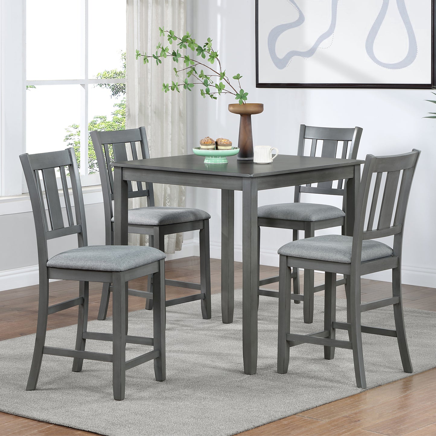 Gray wooden bar table with upholstered stools for dining room seating