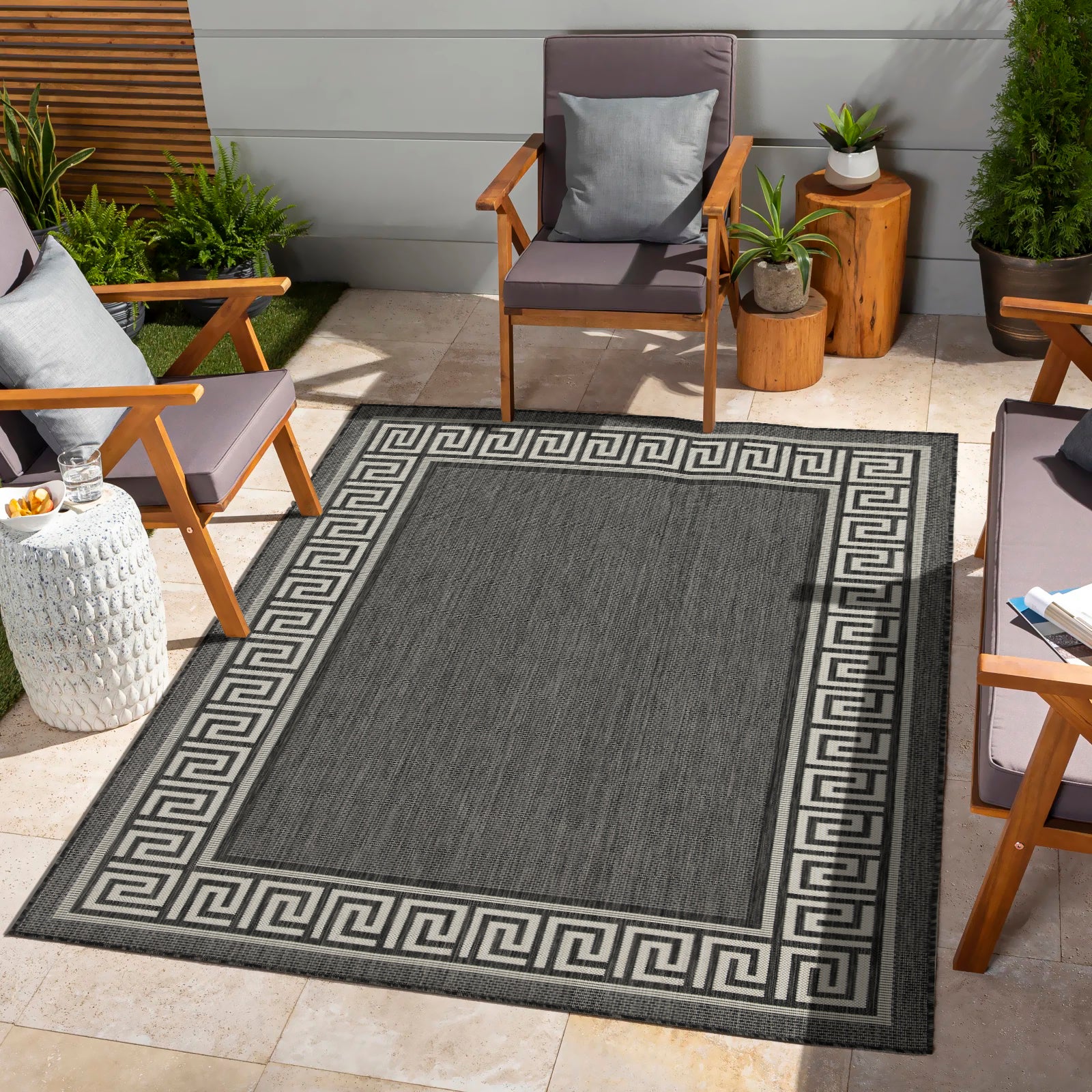 Dark gray outdoor rug with white Greek key border pattern x size