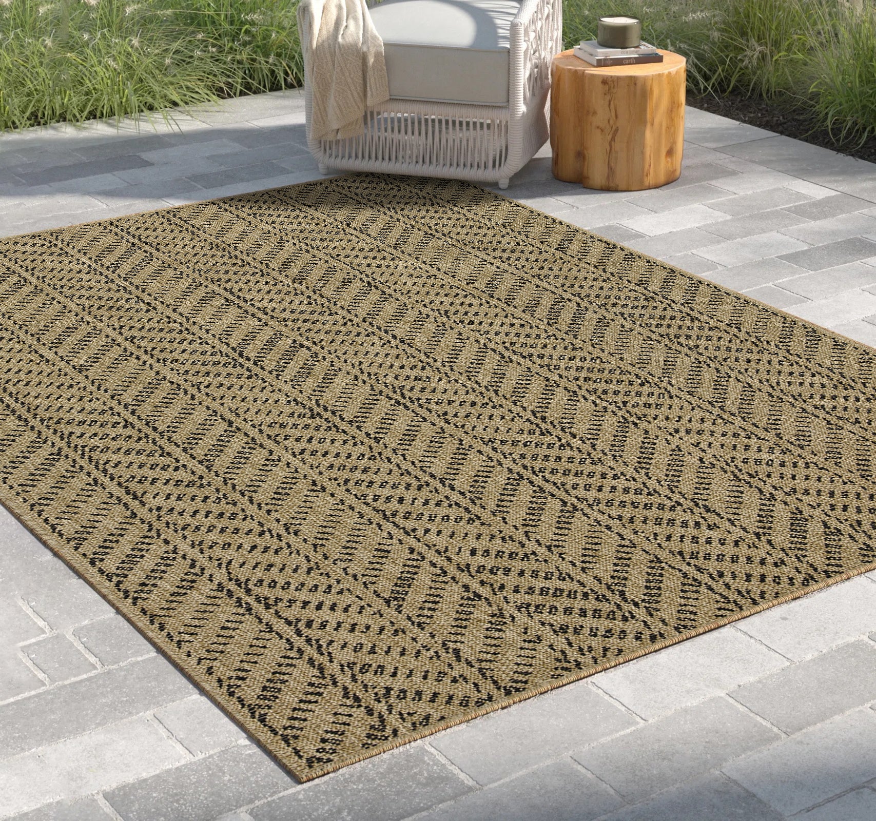Tan and black geometric pattern outdoor rug with woven texture for patio