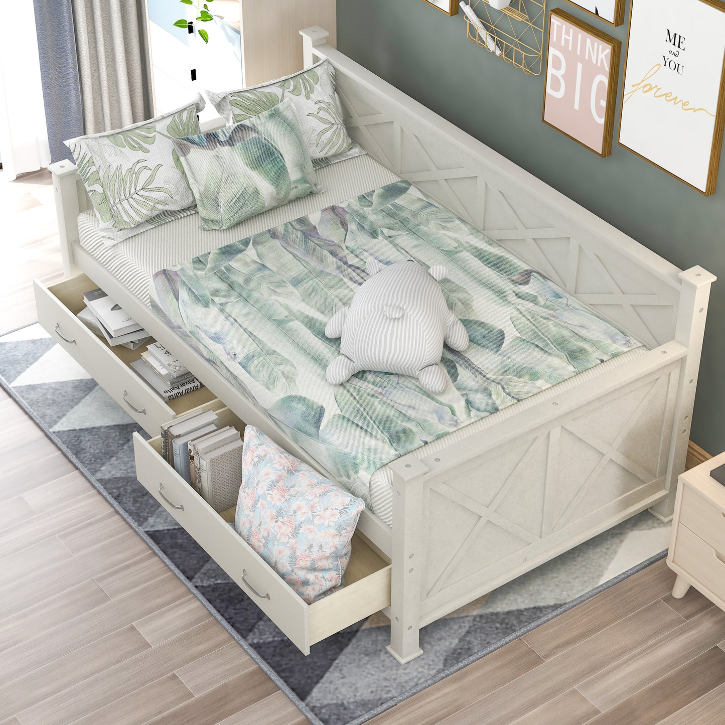 White wooden daybed with botanical print bedding and storage drawers