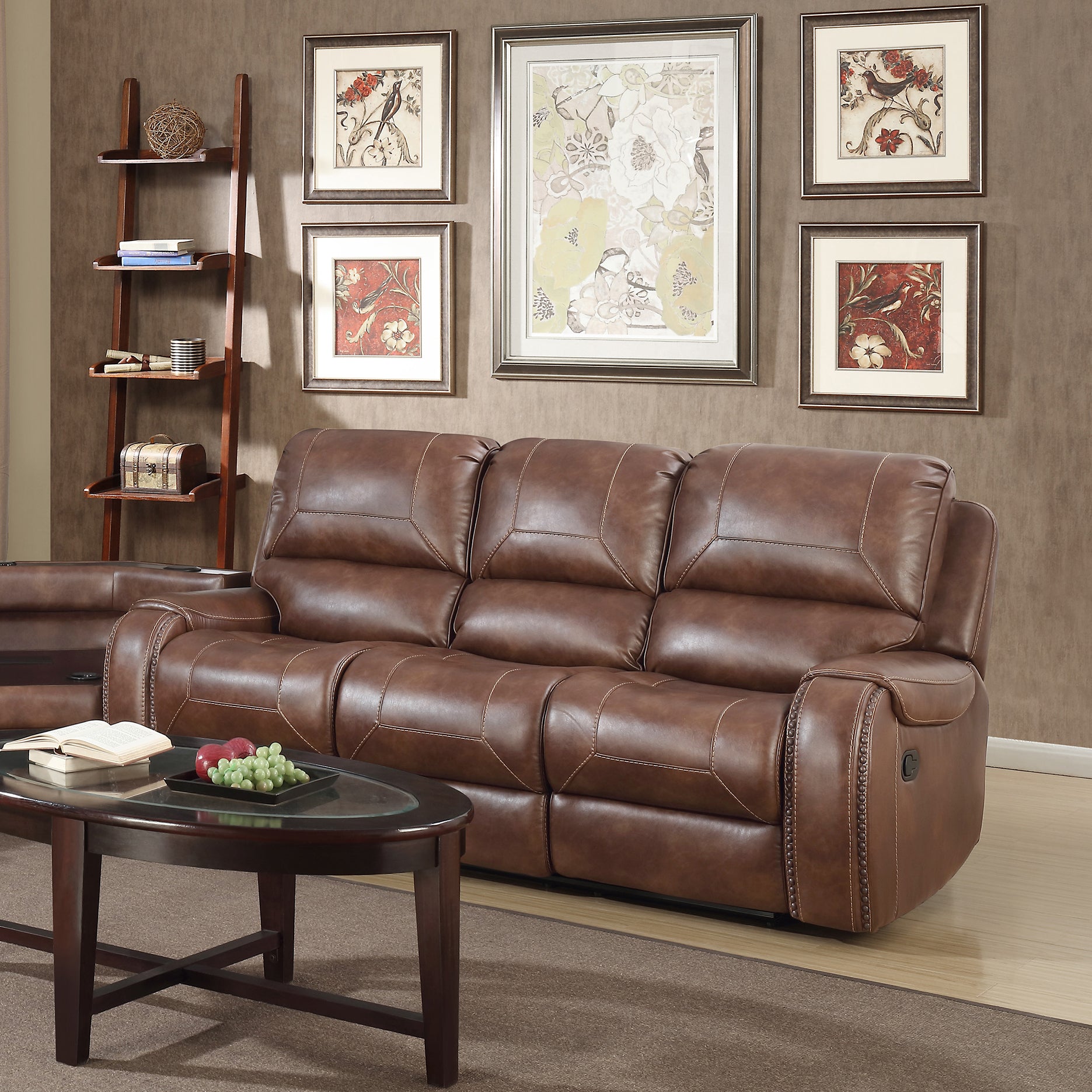 Brown leather recliner sofa with stitched detailing and plush cushions