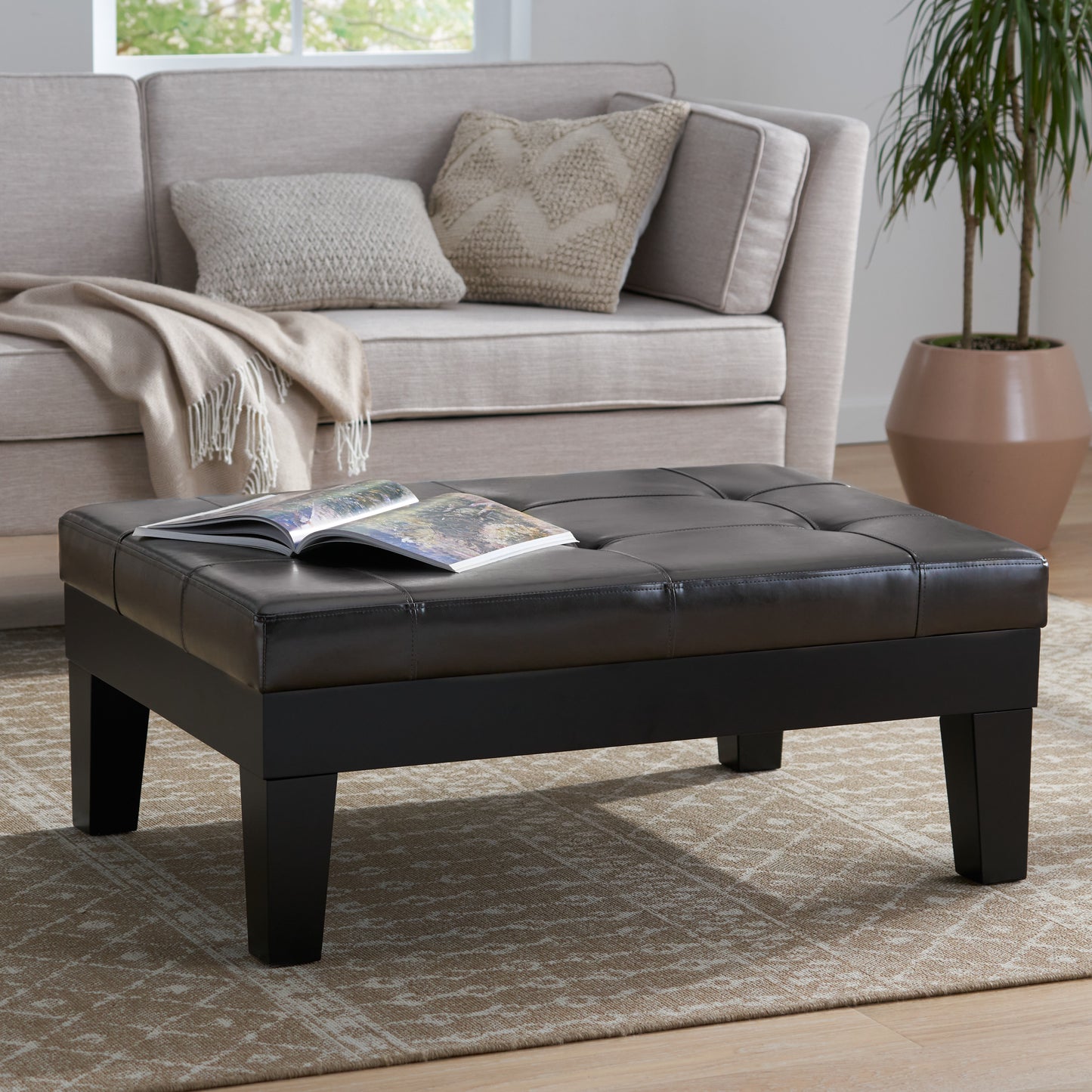 Tufted dark brown faux leather ottoman coffee table with square legs