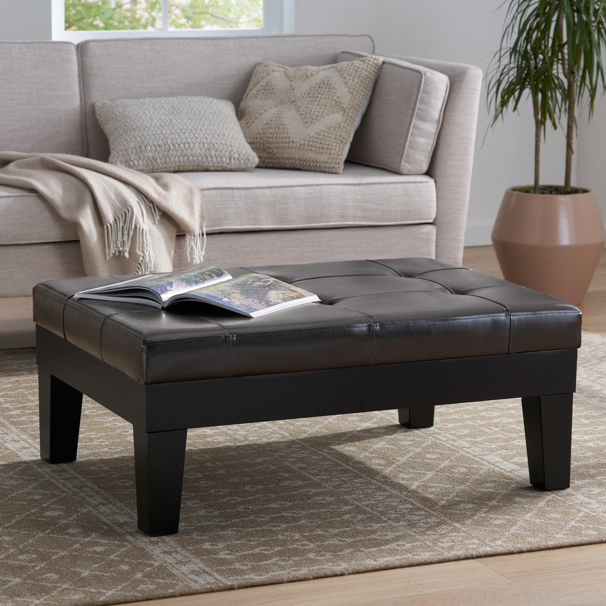 Tufted dark brown faux leather ottoman coffee table with square legs