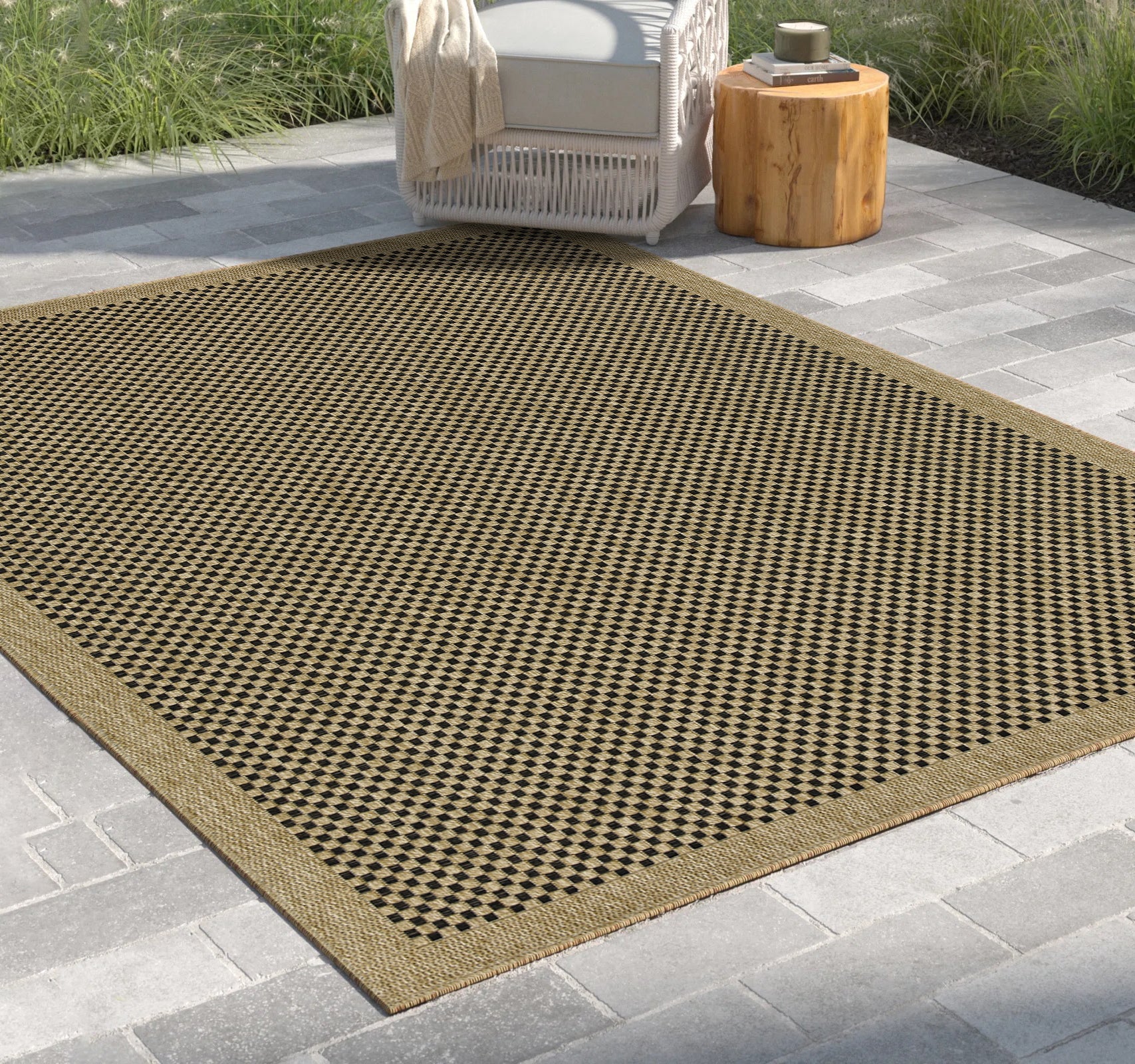Brown and black diamond pattern outdoor rug with woven texture
