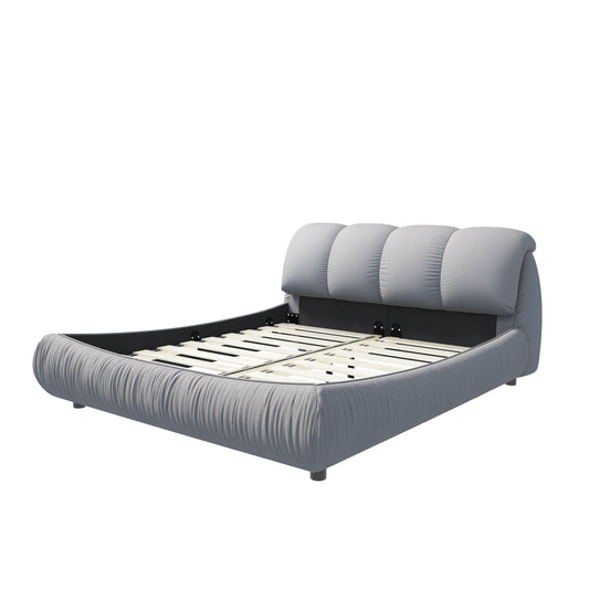 Upholstered platform bed in light grey fabric with a curved headboard and frame