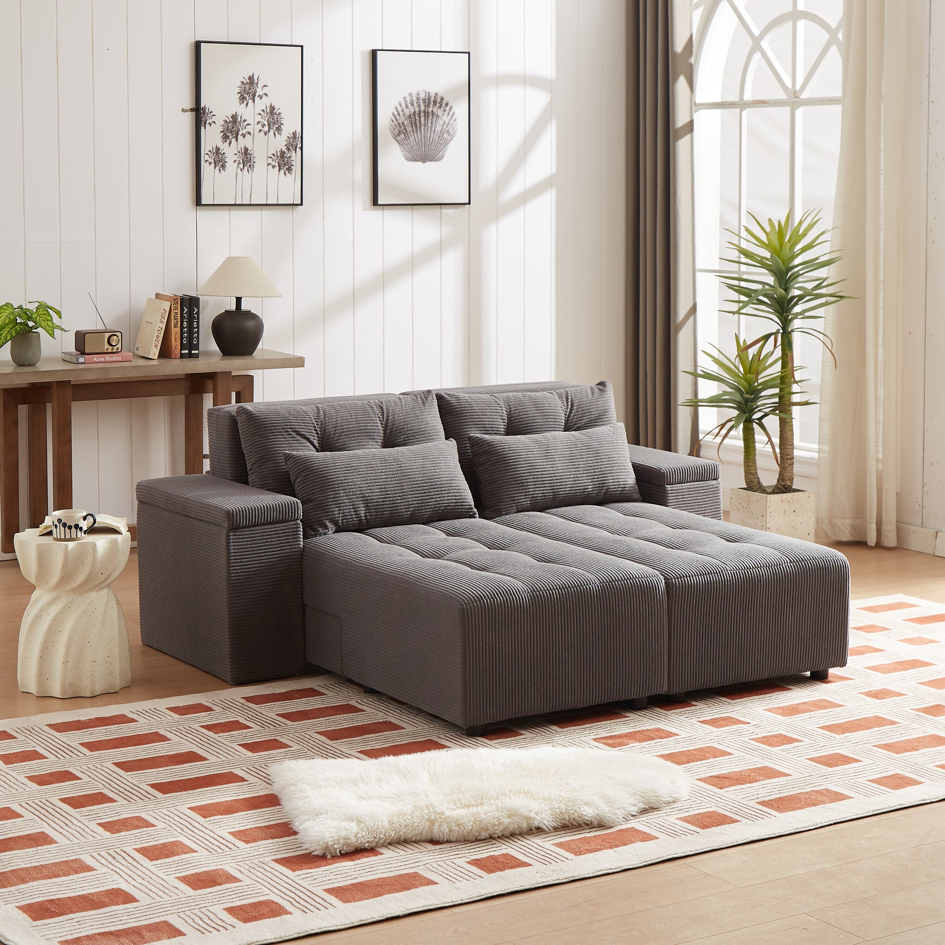 Contemporary grey corduroy sectional sofa with tufted cushions and a chaise lounge