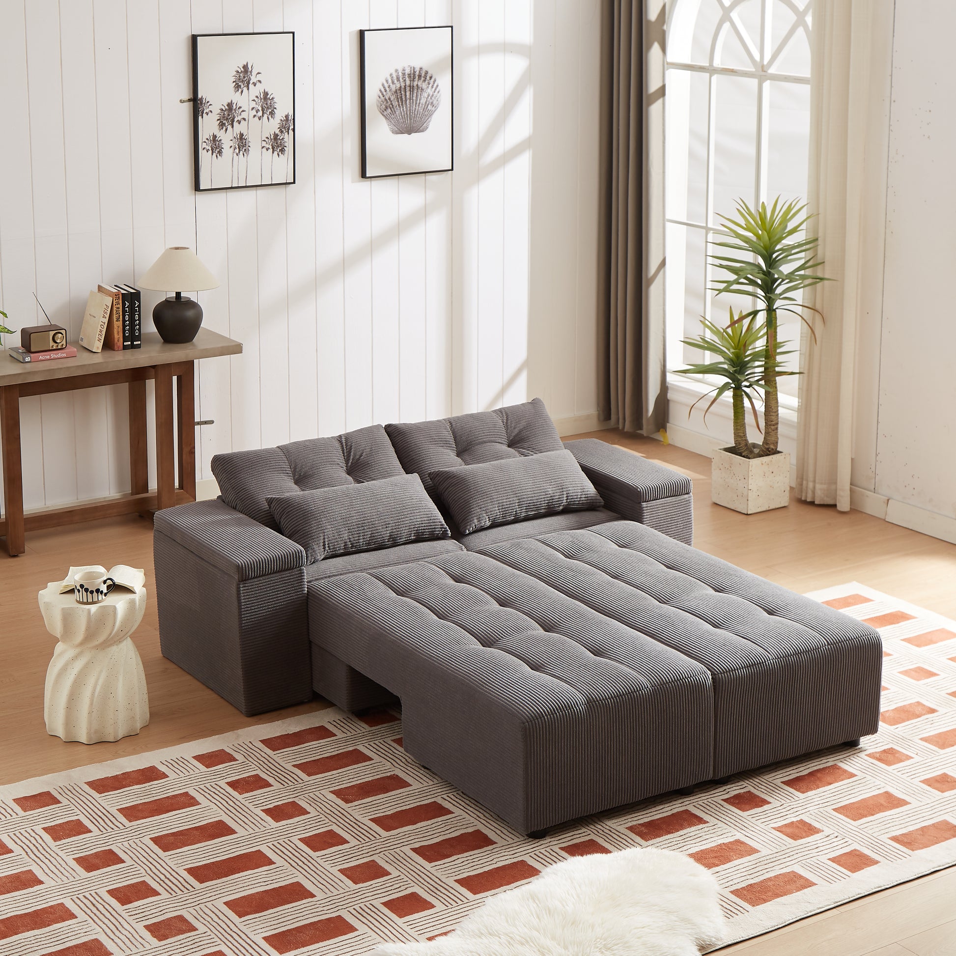 Gray corduroy sofa bed with tufted cushions convertible to sleeping surface