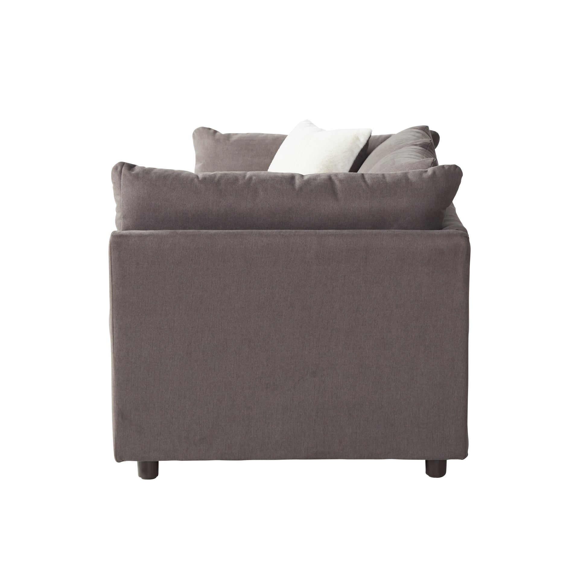 Dark gray fabric sofa with plush cushions and a white accent pillow