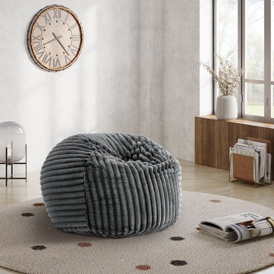 Plush grey corduroy bean bag chair with a round design and soft texture